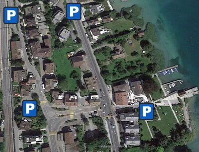 Aerial view of the area around the clinic with four public car parks marked in blue along Seestrasse.